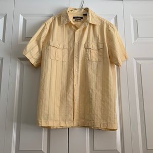 AXIST brand, men’s button up shirt,  100% cotton and in a light gold color.